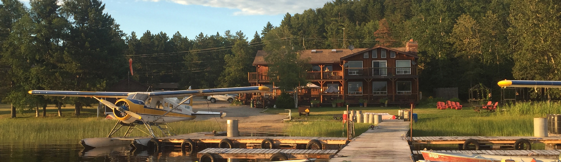 Float Plane by Fishing Dock in Front of Lodge